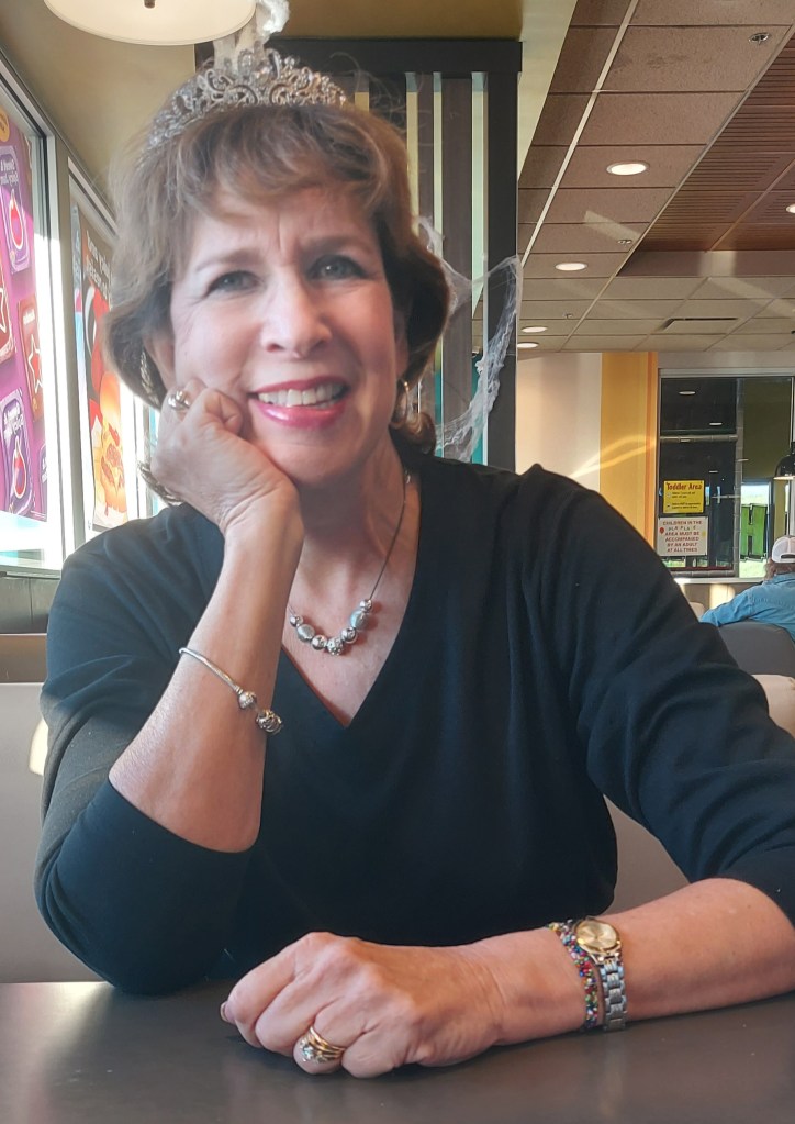 Woman wearing a crown in a McDonald's